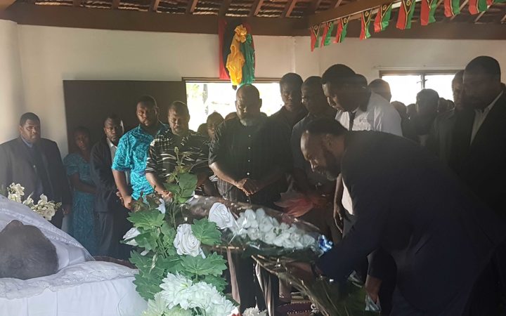 Vanuatu's prime minister Charlot Salwai pays his respects to the late president Baldwin Lonsdale during his lying in state June 2017