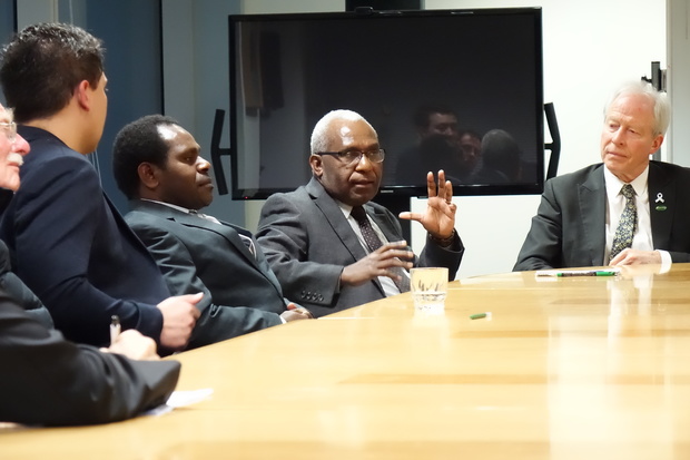 The secretary-general of the United Liberation Movement for West Papua, Octo Mote (centre) talks to New Zealand MPs, including Steffan Browning (right).