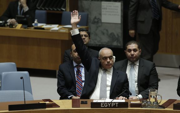Amr Abdel Latif Aboulatta, Permanent Representative of Egypt to the UN, votes in favor of the ban on Israeli settlements.