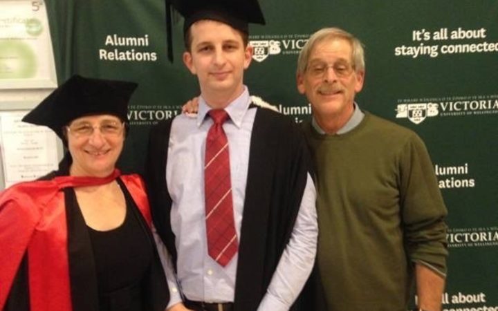Kelly Savage with his mother, Martha, and father, Michael, during his graduation from Victoria University with a BA in Japanese and Psychology. His mother is a professor of geophysics at the university. 