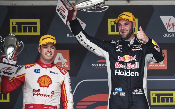 Shane van Gisbergen celebrates winning race one of the 2018 Supercars round at Pukekohe ahead of fellow Kiwi driver Scott McLaughlin.