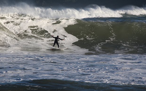 A surfer in Lyall Bay after a storm surge on June 14, 2015. 