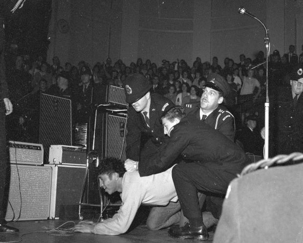 Fans and police during Beatles concert at Wellington Town Hall The Dominion Post Collection Alexander Turnbull Library crop