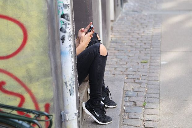 Teen girl texting PD Pixabay