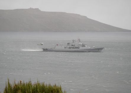 The Navy frigate Te Kaha approaching Campbell Island.