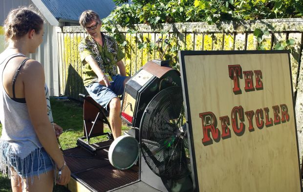 Bryan Crump has a go at recycling at WOMAD Taranaki Photo RNZ