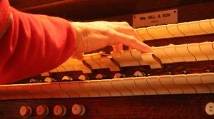 hands playing an organ
