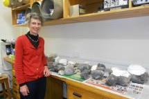 Dr Gillian Turner with the hangi stones