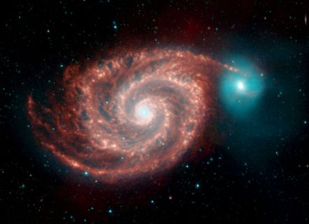 First Peek at Spitzer s Legacy Mysterious Whirlpool Galaxy