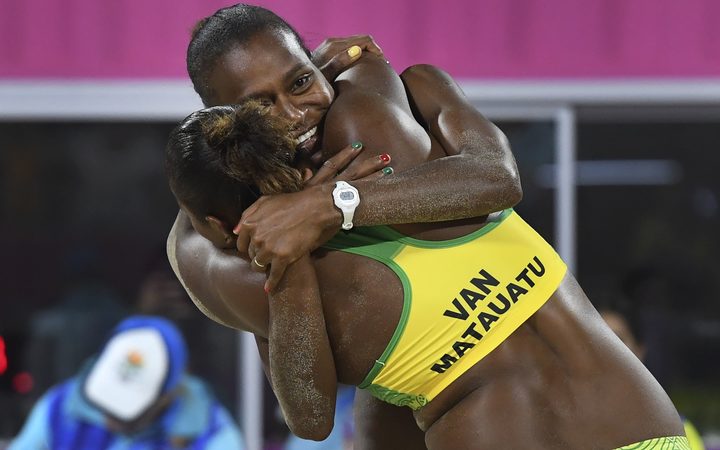 Vanuatu's Miller Pata and Linline Matauatu celebrate winning in the women's beach volleyball bronze medal match against Cyprus 