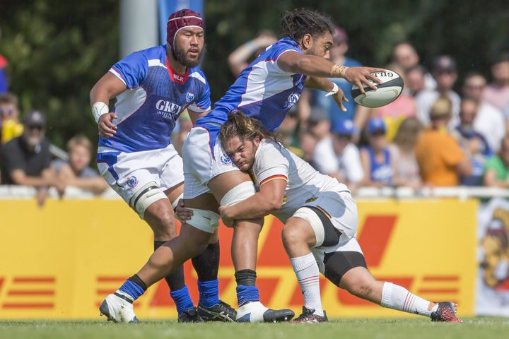 Chris Vui is tackled during Samoa's Rugby World Cup qualifying victory against Germany.