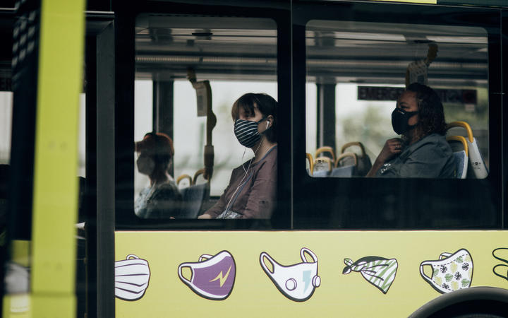 Bus passengers wearing masks during level 2, Wellington 15 February 2021