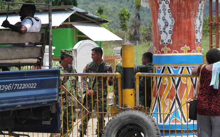 Indonesian soldiers man the border with Papua New Guinea at Wutung.