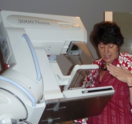 Mammographer Yvonne Clarke demonstrates how the x-ray machine works. 
