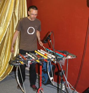 Adrian Croucher playing his cyclical tubaphone