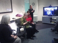 Robyn Hunt admires her farewell gift from the HRC as Chief Commissioner Ros Noonan (foreground) looks on