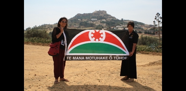 Leanne Tamaki and Karina Ngaropo holding Te Mana Motuhake o Tuhoe flag