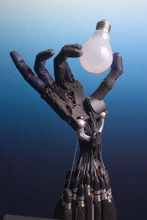 Shadow Dexterous Robot Hand holding a lightbulb CC BY SA Richard Greenhill and Hugo Elias