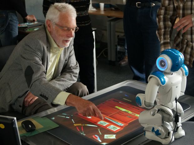 Mark Apperley playing a game with a robot