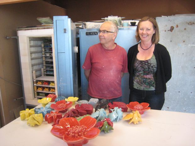 Bob and Alison Steiner in front of a batch of newly fired ceramics at their Avondale pottery studio
