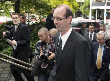 David Bain arriving at court surrounded by media